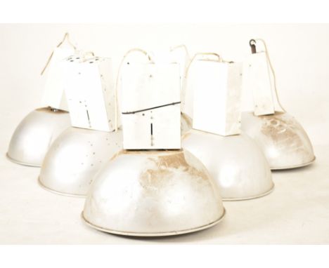 A set of six late 20th century industrial hanging pendant ceiling lights. Each light having a large aluminium pendant shade. 