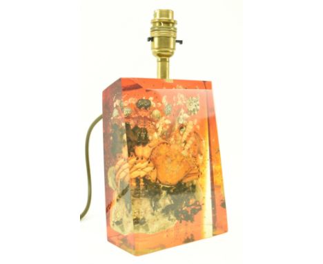 A retro mid 20th century sea themed lucite table lamp light. The lamp of slab form set with shells and crab to the centre wit