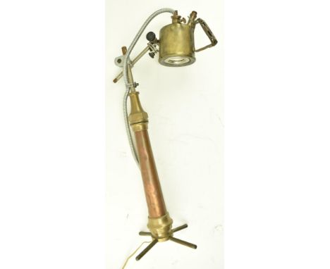 A contemporary copper &amp; metal custom made industrial inspired desk table lamp light. The desk lamp having an adjustable s