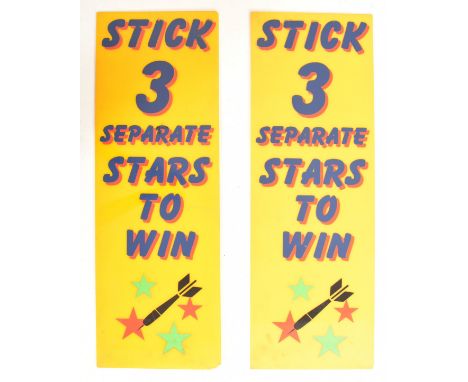 A pair of vintage late 20th century 1970s funfair / fairground darts game signs. Each rectangular fair sign on yellow ground 