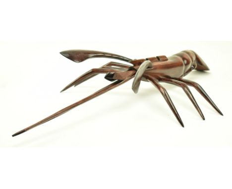 A continental believed French vintage bespoke made carved hardwood sculpture of lobster. The lobster having articulated and r