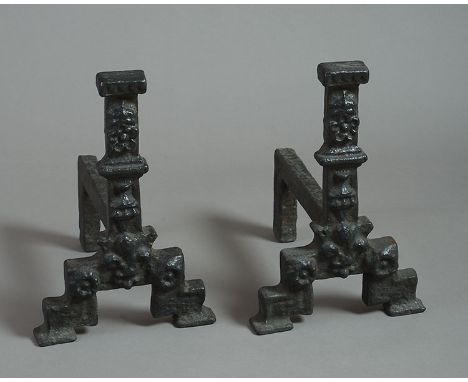 A pair of early 17th century cast iron Andirons, with Tudor rose, crown and goblet moulded decoration, on stepped legs with o