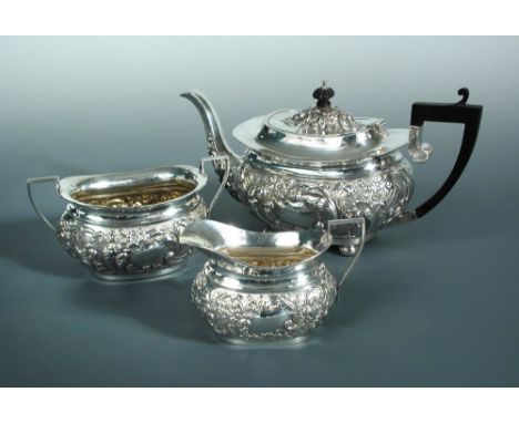 A Victorian silver three piece tea set, by Charles Harrold and Co., Birmingham 1899, the teapot of oval rounded form raised o