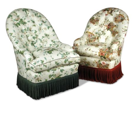 A pair of large country house tub armchairs, button upholstered in a floral printed fabric with loose cushion seats and bulli