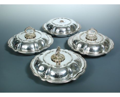 Four Victorian silver entrée dishes and covers, three bases possibly by Creswick & Co, Sheffield 1872, engraved with the cres