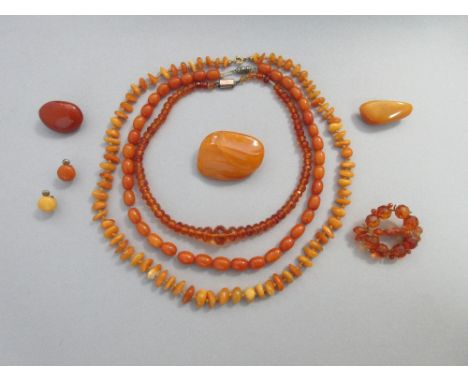 A collection of butterscotch and other vintage amber bead necklaces and jewellery, the first necklace of graduated oval butte