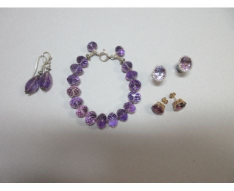 A pair of amethyst and diamond earrings and a small collection of other amethyst jewellery, the first earstuds with a large o