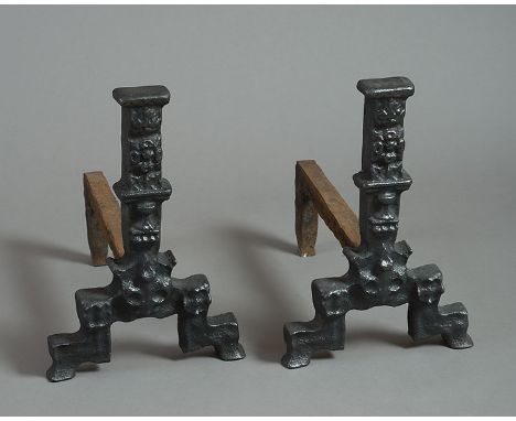 A pair of 16th century cast iron pillar Andirons, with Tudor rose & crown, goblet and fleur de lys moulded columns, on steppe