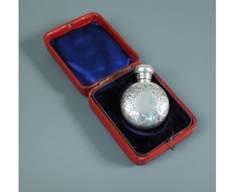 A Victorian silver flask shaped scent bottle, by George Watts & Co, Chester 1895, decorated all over with engraved foliate sw