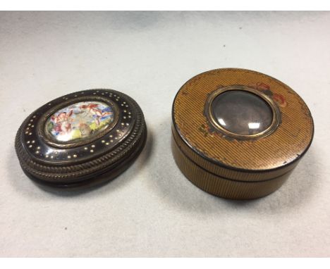 An 18th century tortoiseshell and enamel snuff box and a papier mache snuff box, the centre of the first painted with two amo