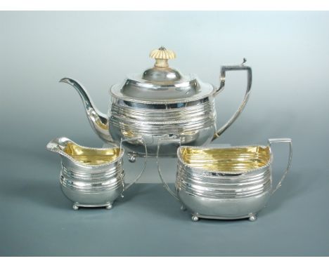 A George III silver 3 piece tea set, by Duncan Urquhart and Napthali Hart, London 1809/10, the teapot of compressed rectangul