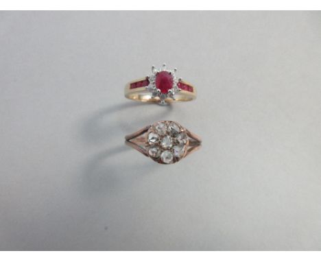 A ruby and diamond cluster ring together with an antique rose cut diamond cluster ring, the first with an oval cut ruby claw 