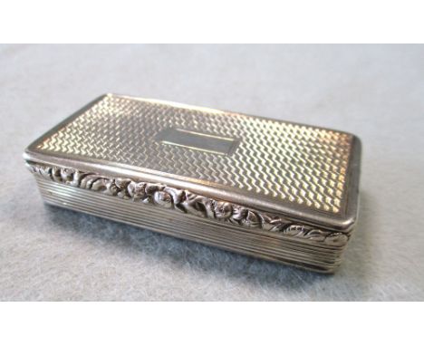 A George IV silver snuff box, probably by John Tongue, Birmingham 1824, of rectangular form, the body engine turned all over,