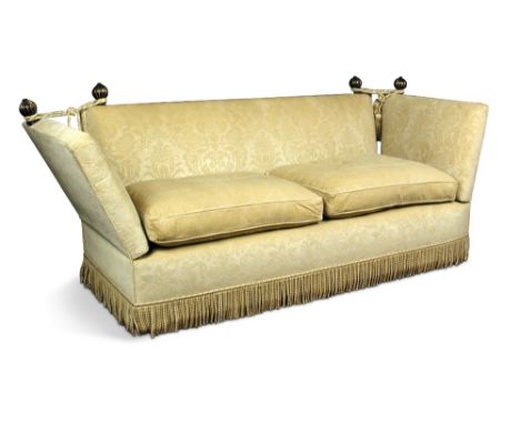 A Knowle sofa, upholstered in a camel ground pattered fabric, with loose cushion seats, finials and ropes 97 x 220 x 95cm (38