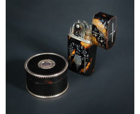 A silver inlaid tortoiseshell etui with contents and a circular box, the first with complete fittings, the exterior worked wi