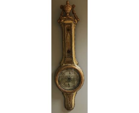 A 19th century French wheel barometer, the painted and gilt wood case with swagged urn top above thermometer and 23cm dial 10