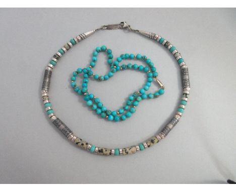 A silver, 'turquoise' howlite and dalmation jasper necklace by Anne Farag together with a turquoise bead necklace, the first 