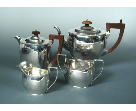 A silver three piece tea set and hot water jug en suite, by S Blanckensee & Sons, Birmingham 1927, of rectangular tapered for