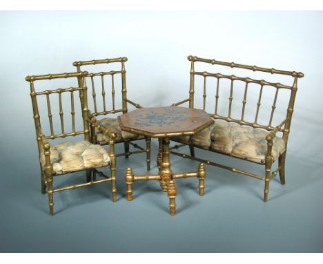 A doll's house table, two chairs and a settee, each with gilded wood to simulate bamboo, the chairs button upholstered in pal