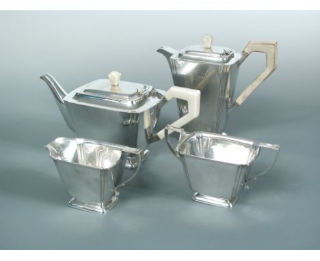 An Edward VIII Art Deco style silver 4 piece tea set, London 1936, of slightly flared rectangular form, the teapot and hot wa