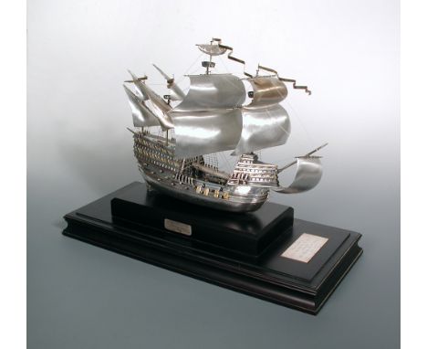 A modern silver model of Henry VIII flagship 'Mary Rose' in full sail, Birmingham 1984, attached to a wooden plinth 33cm (13i