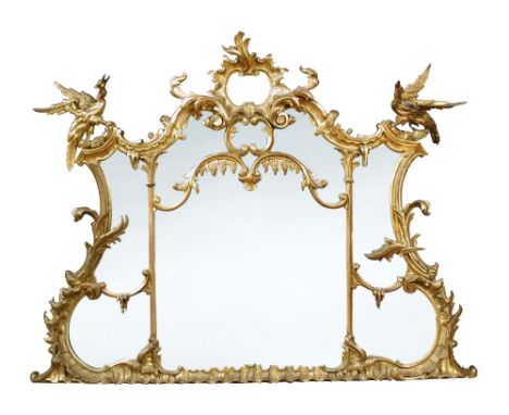 An 18th century giltwood overmantle mirror in the manner of Chippendale, of carved rococo design with Ho-Ho birds, rocaille a