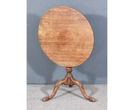 A 19th Century Mahogany Circular Tripod Occasional Table, the plain top on turned and spiral fluted central column, leaf capp