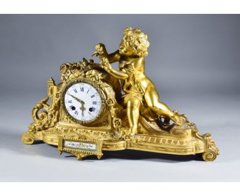 A 19th Century French Guilt Metal Cased Mantel Clock by Henri Marc of Paris, the 3ins diameter white enamel dial with Roman a