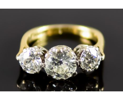 An 18ct Gold Three Stone Diamond Ring, 20th Century, set with three brilliant cut round diamonds, approximately 2.7ct total, 