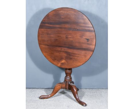 A George III Mahogany Circular Tripod Occasional Table, on cabriole legs with pad feet, 29ins diameter x 28ins high