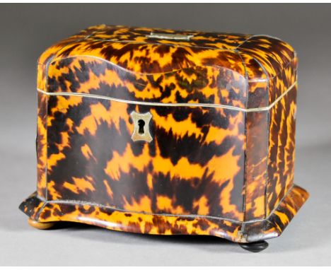 A Tortoiseshell Two-Division Tea Caddy, 19th Century, with serpentine front, white metal cartouche to lid and inlaid with pew