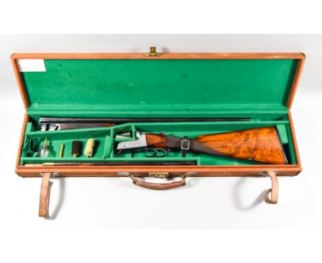 A 12 Bore Side by Side Shotgun by William Ford, Serial No.17350, 25ins blued steel barrel, bright action engraved with scroll