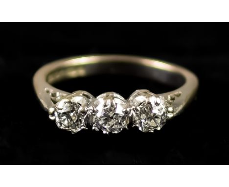 An 18ct White Gold Three Stone Diamond Ring, 20th Century, set with three brilliant cut white diamonds, approximately .75ct t