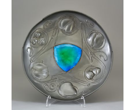 Archibald Knox for Liberty & Co., the Bollellin Shield, a pewter and enamel circular dish cast with flowers and foliage and w