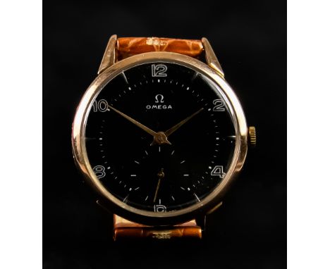 A Gentleman's Manual Wind Wristwatch by Omega, 40mm diameter 18ct gold case, black dial with white Arabic numerals and subsid