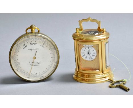 A Miniature Brass Oval Shaped Carriage Timepiece, oval form, with enamel dial and movement stamped J * D, 9cm over handle, to