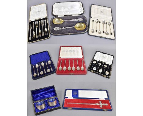 A Collection of Assorted Cased Sets of Silver Flatware, including a cased set of coffee-spoons, the backs of the bowls enamel