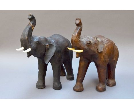 Two Small Leather Elephants in the Liberty Style30.75cm, one with a broken trunk re glued and a missing ear. Both with genera