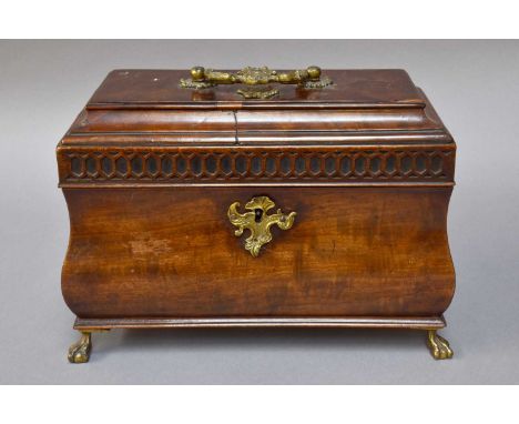 A George III Mahogany Tea Caddy of Ogee Shape, with ormolu mounts, blind fret carving, and opening to reveal three compartmen