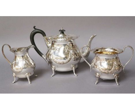 A Three-Piece George V Silver Tea-Service, by Lambourne and Co., Birmingham, 1912, each piece tapering the sides chased with 