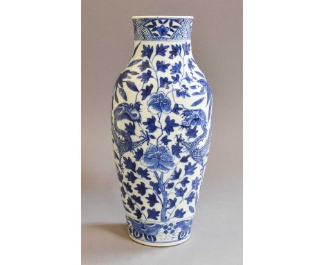 A Chinese Blue and White Vase, 19th century, painted in underglaze blue with a pair of dragons on a ground of stylized foliag