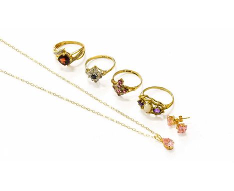 Four 9 Carat Gold Gem-Set Rings, including a garnet example, an opal and amethyst example etc; together with A Pink Stone Pen