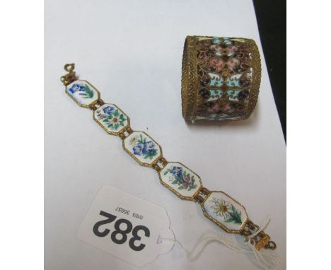 An enamel and metal floral bracelet and a napkin ring