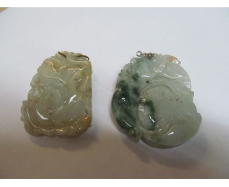 A jade pendant and another