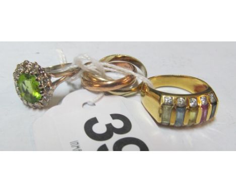 An 18ct white gold ring set diamond and peridot, ring set different coloured stones marked 750 and three band 9ct ring