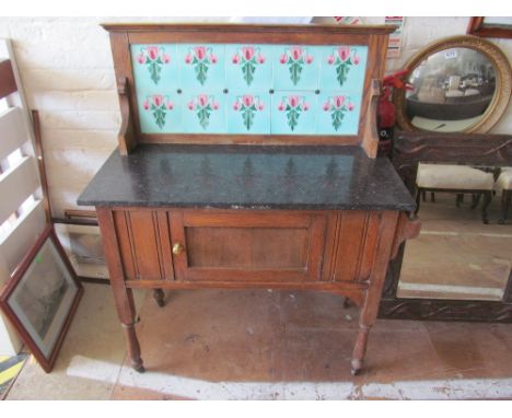 A tile back and marble top washstand