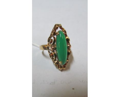 A ring marked 585 set green stone