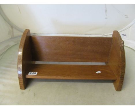 A Robert Mouseman book trough with long tail mouseappears varnished and diagonal lines where shelves meet sides