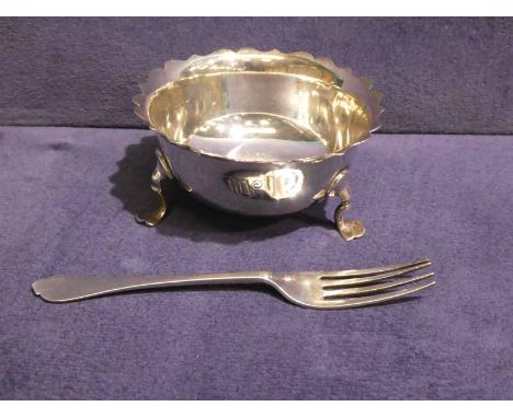 A small silver three footed Bowl and a silver Fork, 3.08oz