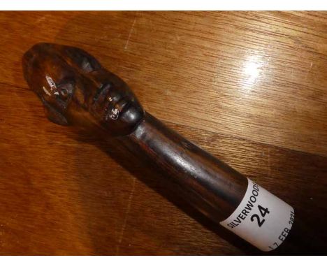 An early 20thc African souvenir Walking Stick, twist shaft and carved head pommel, 95cm long 